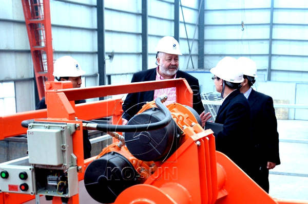 Clients Checking Equipment on Factory Worksite